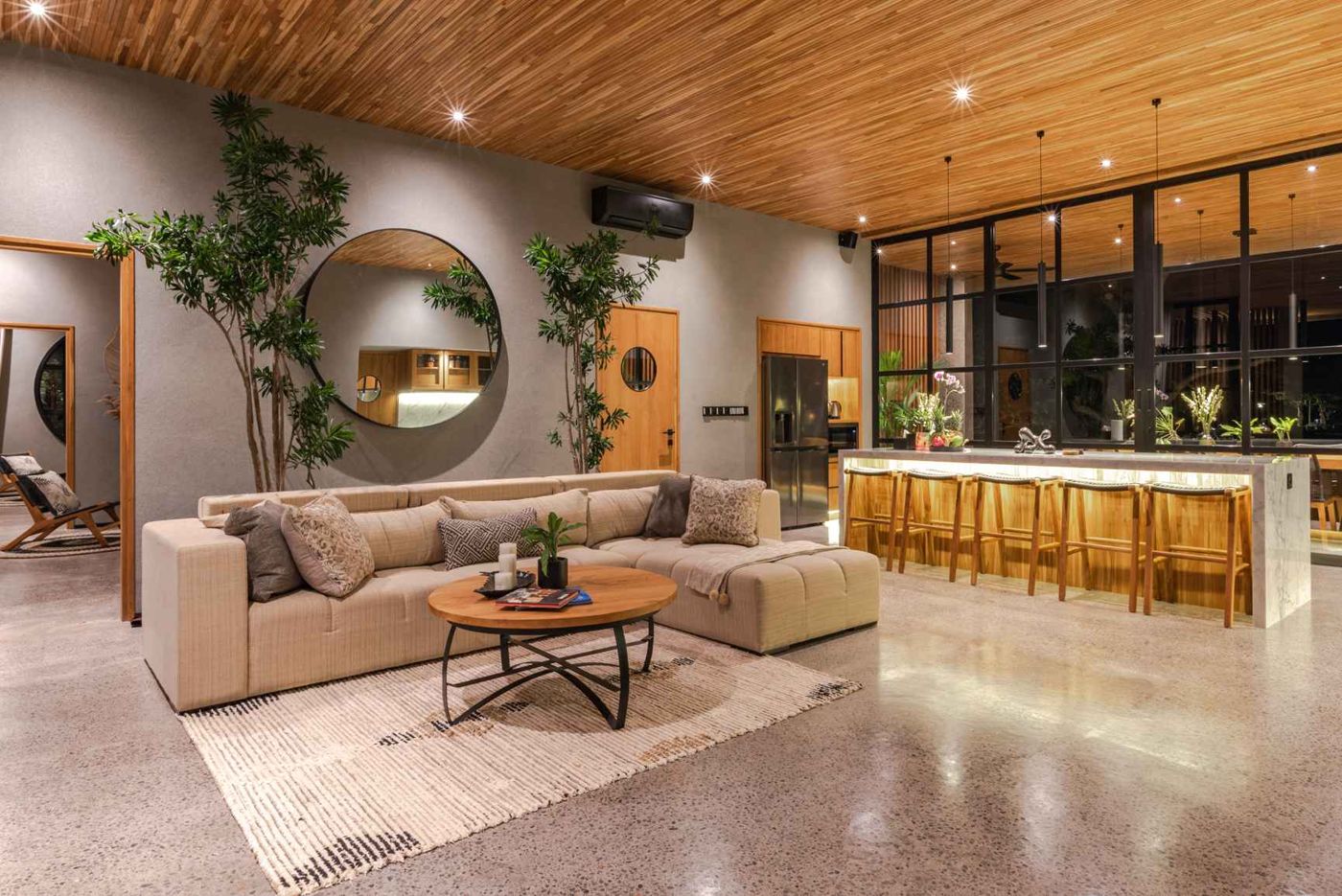 The living room and marble kitchen bar at night